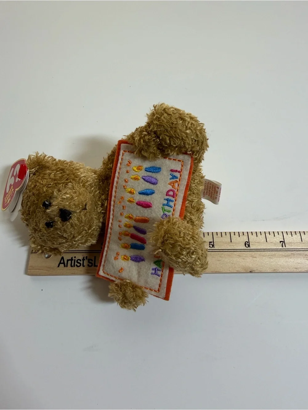 Ty Brown Beanie Baby Teddy Holding Colorful Birthday Banner Plush